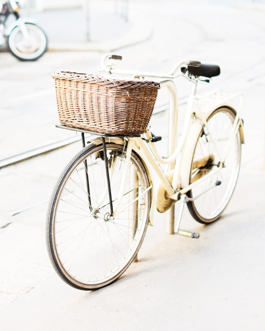 cream colored bicycle with basket